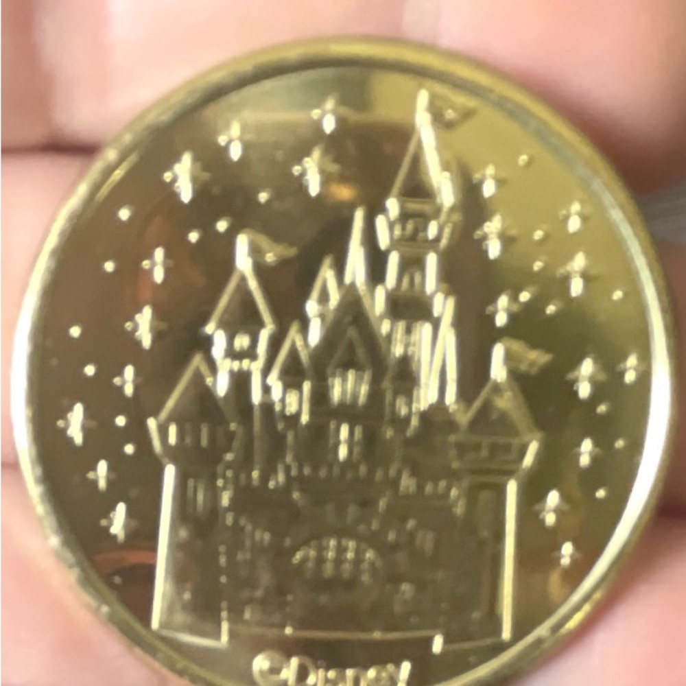 Disney magic key golden medallion Disney castle